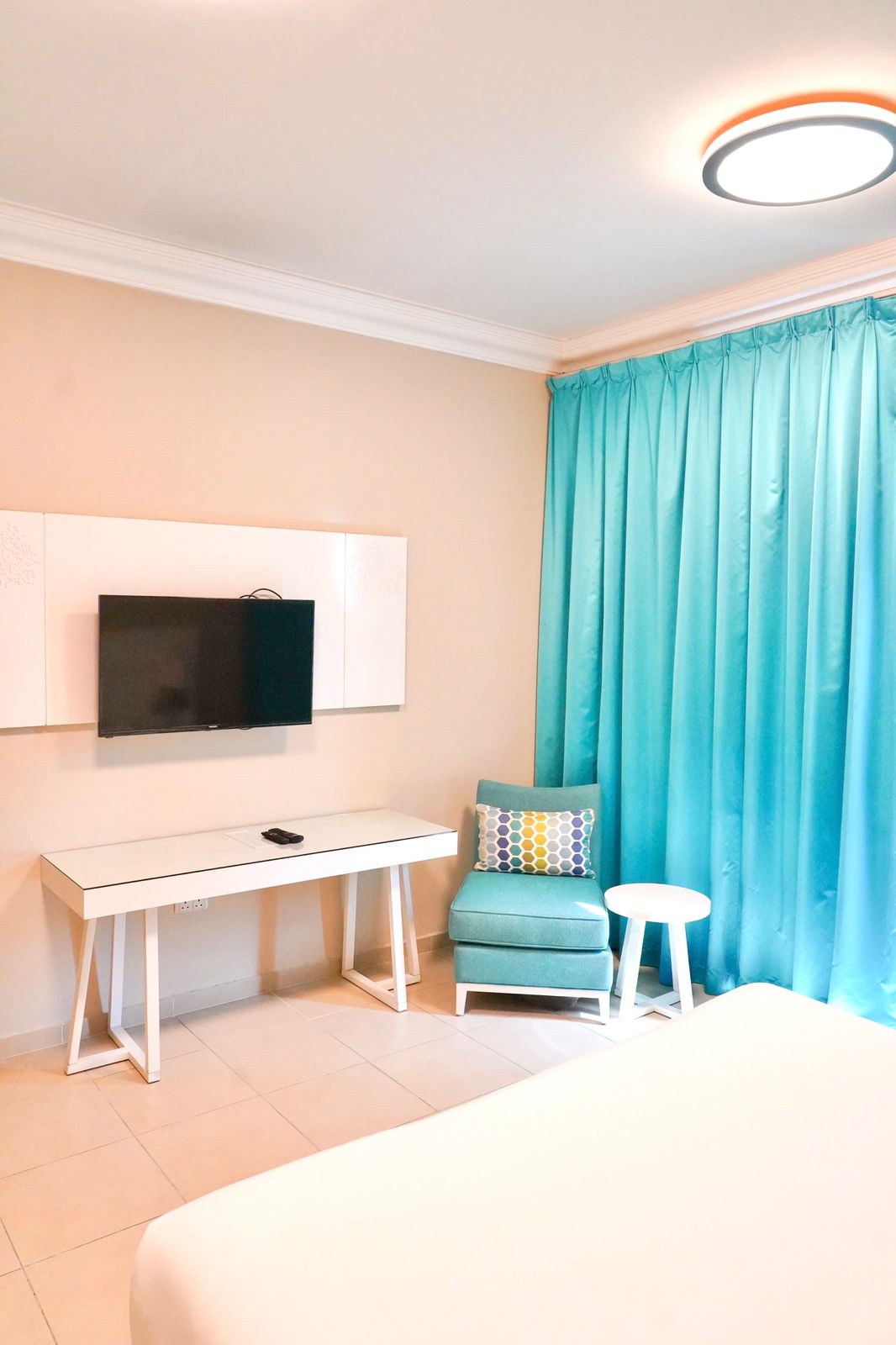 An Arm Chair and a TV in Andalus By Al Seef Resort and Spa